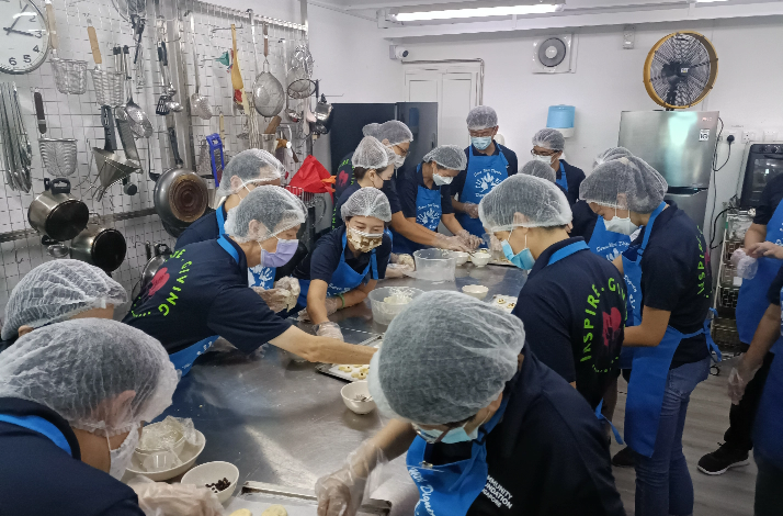 A group of people baking