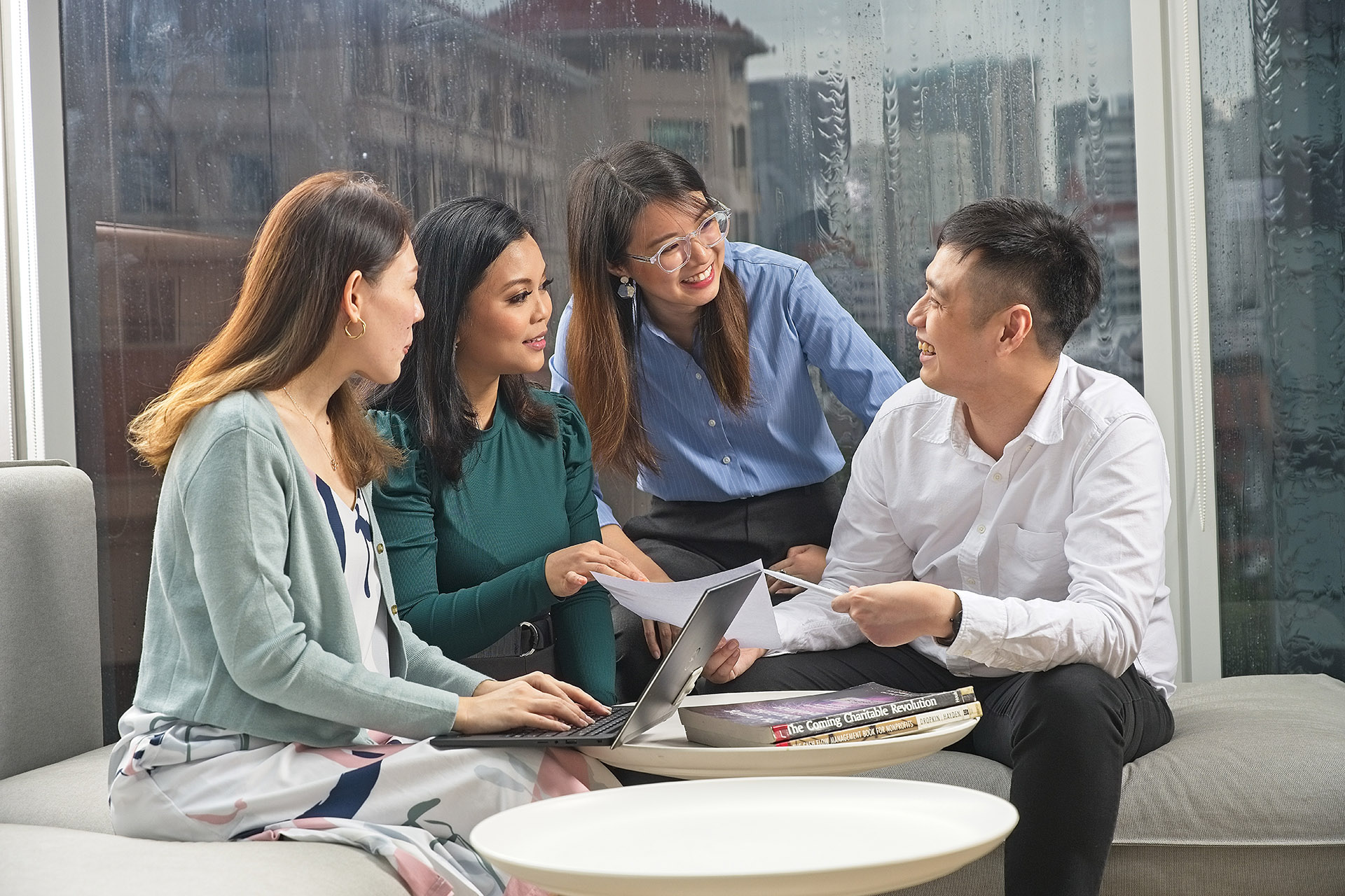 A group of young individuals discussing a project