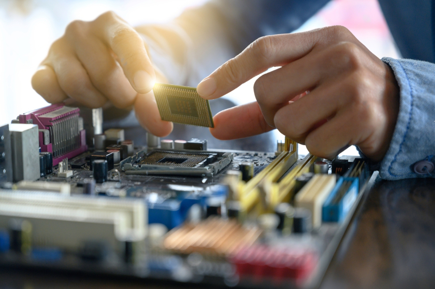 A guy putting down a CPU chip