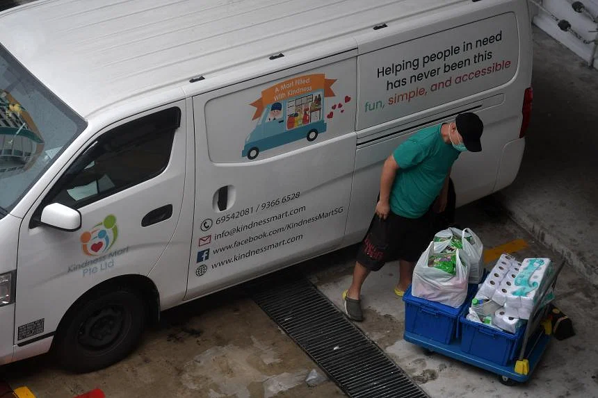 a person standing next to a white van