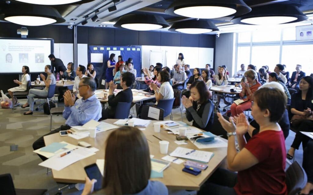 people sitting in groups to discuss