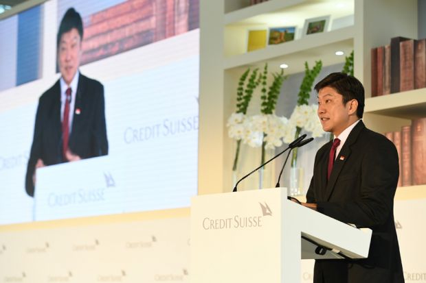 a man standing behind a lectern giving a speech