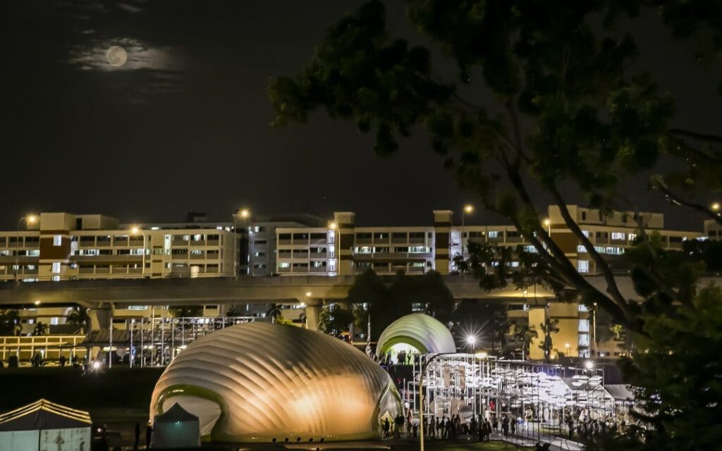 Bright moon illuminating serene city park.